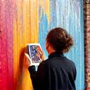 Local artist painting a mural in Edinburgh