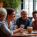 Diverse group of people enjoying coffee together in a cafe