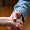 A handshake demonstrating trust and partnership